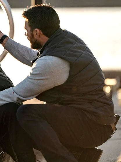 Joe Travers Alarum 2025 Scott Eastwood Black Vest